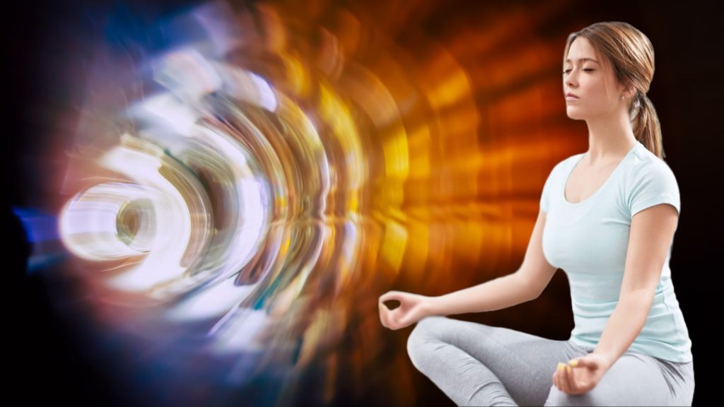 Woman Meditating in front of vibrant sound waves